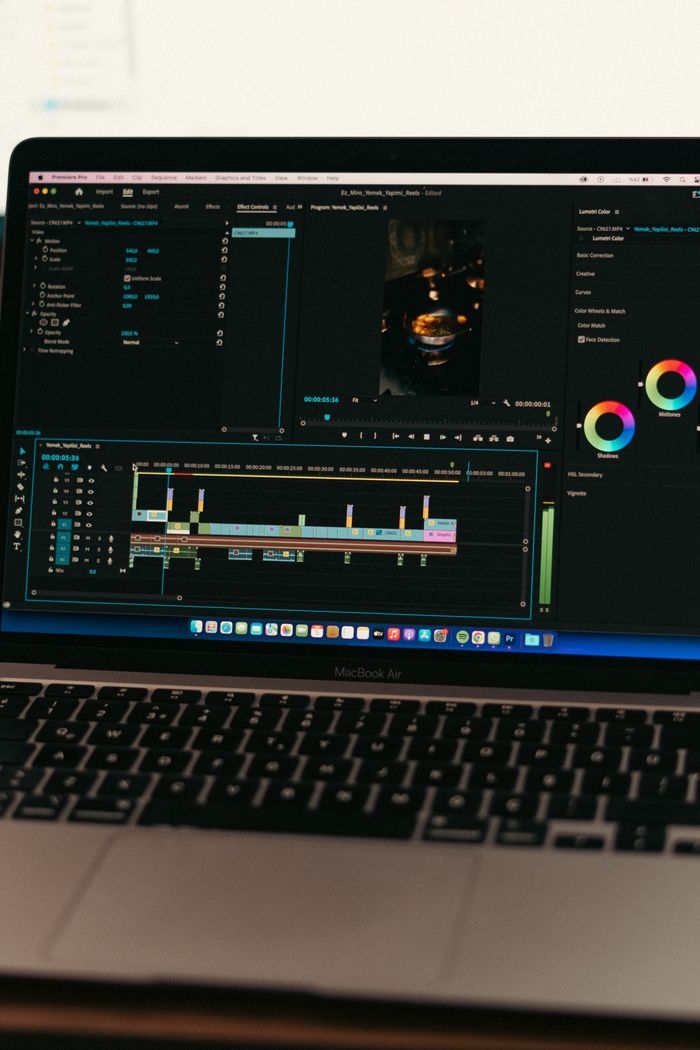 services-03 MacBook Air displaying video editing software interface, ideal for technology and digital content themes.